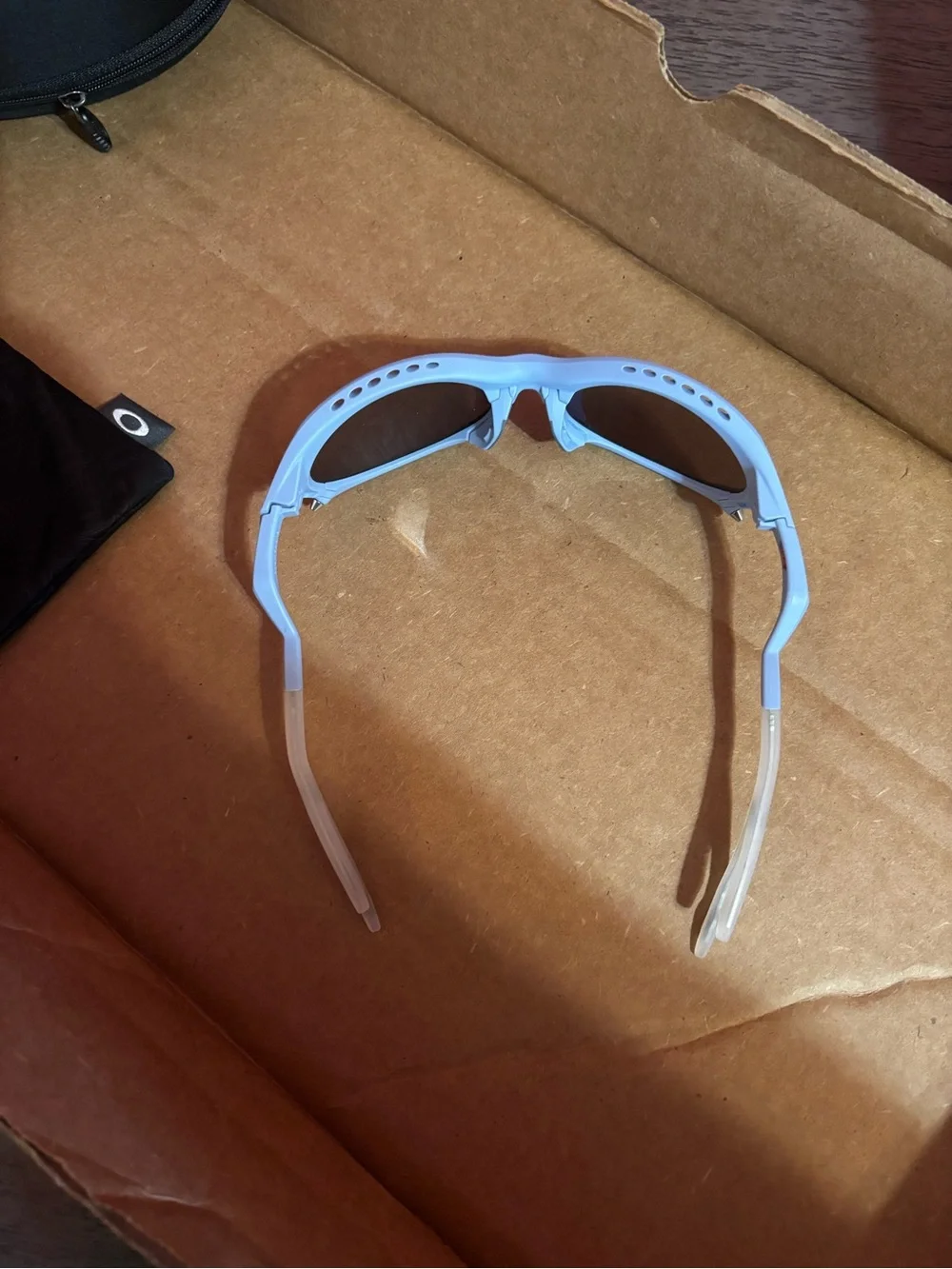 Oakley Light Blue PLANTARIS Sunglasses with Mirrored Lenses